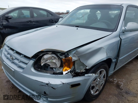 2003 Hyundai Accent GL with VIN KMHCG35C23U264360, listed as a IAAI auction lot 42033316 with 100,991 mi miles. Bid and sale history available at carsss.com. Image 6.