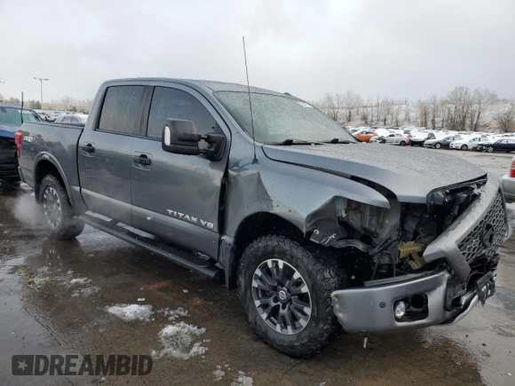 2018 Nissan Titan Pro-4X z VIN 1N6AA1E51JN536680, wystawiony jako Copart lot #82361724 z przebiegiem 98 699 mil mil oraz Szkoda całkowita • Salvage title. Historia ofert i sprzedaży dostępna na DreamBid. Obrazek 4.
