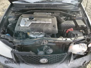 2005 Kia Spectra with VIN KNAFE161655093051, listed as a Copart auction lot 77821904 with 104,874 mi miles and Salvage Title. Bid and sale history available at carsss.com. Image 12.