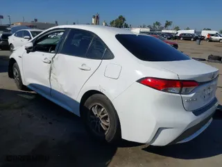 2020 Toyota Corolla Hybrid LE with VIN JTDEBRBEXLJ013138, listed as a IAAI auction lot 40269735 with 140,602 mi miles. Bid and sale history available at carsss.com. Image 3.