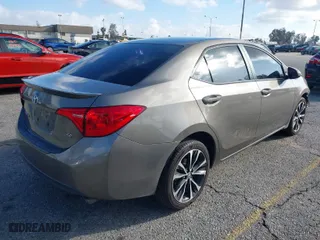 2019 Toyota Corolla L with VIN 5YFBURHEXKP922883, listed as a IAAI auction lot 41702924 with 99,166 mi miles. Bid and sale history available at carsss.com. Image 4.