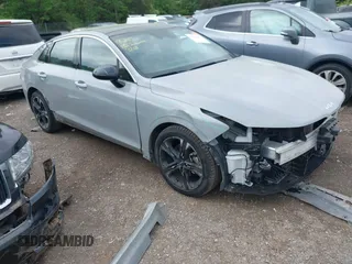 2023 Kia K5 GT-Line z VIN 5XXG64J22PG215361, wystawiony jako IAAI lot #42045477 z przebiegiem 41 325 mil mil oraz . Historia ofert i sprzedaży dostępna na DreamBid. Obrazek 1.