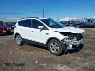 2014 Ford Escape SE with VIN 1FMCU0GX6EUA20379, listed as a IAAI auction lot 42082363 with 129,059 mi miles. Bid and sale history available at carsss.com. Image 1.
