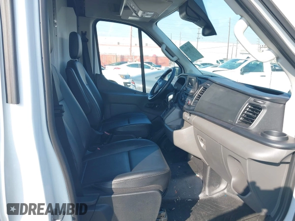 2023 Ford Transit Cargo with VIN 1FTBR1C85PKC08945, listed as a IAAI auction lot 41385685 with 5,577 mi miles and . Bid and sale history available at DreamBid. Image 5.