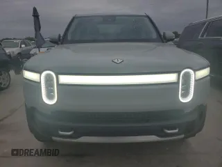 2022 Rivian R1T Adventure z VIN 7FCTGAAA0NN014488, wystawiony jako Copart lot #51024514 z przebiegiem 18 721 mil mil oraz Szkody całkowita. Historia ofert i sprzedaży dostępna na DreamBid. Obrazek 5.