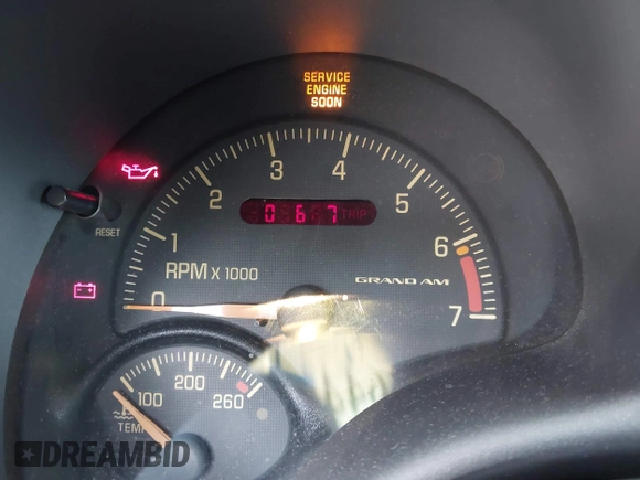 1999 Pontiac Grand Am SE2 with VIN 1G2NE52T0XM702788, listed as a IAAI auction lot 42564414 with 195,067 mi miles and . Bid and sale history available at DreamBid. Image 12.