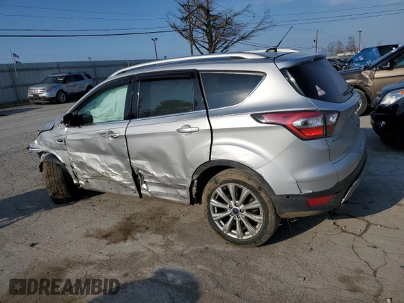 2017 Ford Escape Titanium with VIN 1FMCU9J95HUA48080, listed as a Copart auction lot 83202034 with 122,528 mi miles and Salvage Title. Bid and sale history available at carsss.com. Image 2.