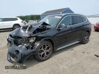 2018 BMW X1 xDrive28i with VIN WBXHT3C36J3H29952, listed as a Copart auction lot 59679285 with 75,220 mi miles and Salvage title. Bid and sale history available at DreamBid. Image 1.