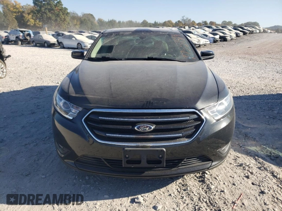 2015 Ford Taurus SEL with VIN 1FAHP2E90FG148821, listed as a Copart auction lot 77557384 with 141,514 mi miles and Salvage Title. Bid and sale history available at DreamBid. Image 5.