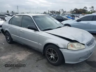 2000 Honda Civic VP with VIN 2HGEJ6616YH578067, listed as a IAAI auction lot 41893676 with 142,807 mi miles. Bid and sale history available at carsss.com. Image 1.