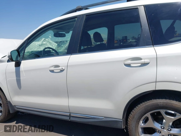 2015 Subaru Forester Touring with VIN JF2SJAWC8FH588321, listed as a IAAI auction lot 42689364 with 103,642 mi miles and . Bid and sale history available at DreamBid. Image 14.