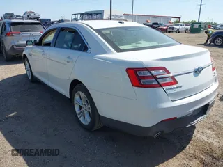 2015 Ford Taurus SEL z VIN 1FAHP2E8XFG196270, wystawiony jako IAAI lot #42007068 z przebiegiem 150 093 mil mil oraz . Historia ofert i sprzedaży dostępna na DreamBid. Obrazek 3.