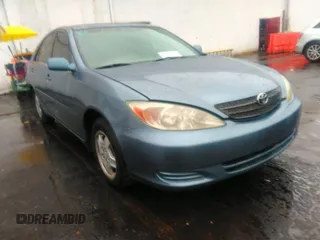2002 Toyota Camry XLE z VIN 4T1BF32KX2U526876, wystawiony jako IAAI lot #40726321 z przebiegiem 202 545 mil mil oraz . Historia ofert i sprzedaży dostępna na DreamBid. Obrazek 1.
