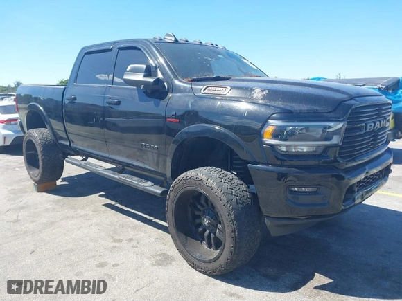 2019 Ram 2500 Laramie with VIN 3C6UR5FLXKG710325, listed as a IAAI auction lot 41853777 with 104,286 mi miles. Bid and sale history available at carsss.com. Image 1.