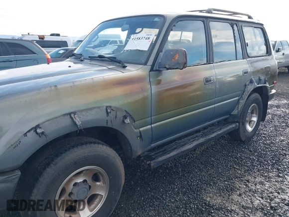 1995 Toyota Land Cruiser z VIN JT3DJ81W0S0094999, wystawiony jako IAAI lot #41583748 z przebiegiem 93 454 mil mil oraz . Historia ofert i sprzedaży dostępna na DreamBid. Obrazek 6.