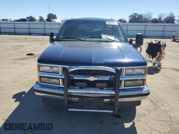 1999 Chevrolet Suburban with VIN 1GNEC16R1XJ394144, listed as a Copart auction lot 50418185 with 173,037 mi miles and Salvage title. Bid and sale history available at DreamBid. Image 5.