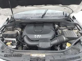 2012 Jeep Grand Cherokee Laredo with VIN 1C4RJFAG6CC297958, listed as a IAAI auction lot 40859811 with 213,499 mi miles. Bid and sale history available at carsss.com. Image 10.