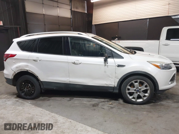 2016 Ford Escape Titanium with VIN 1FMCU9J94GUB02810, listed as a IAAI auction lot 41643907 with 119,684 mi miles. Bid and sale history available at carsss.com. Image 6.