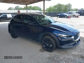 2024 Mazda CX-30 S Select Sport z VIN 3MVDMBBM8RM696181, wystawiony jako IAAI lot #42462813 z przebiegiem 23 690 mil mil oraz . Historia ofert i sprzedaży dostępna na DreamBid. Obrazek 1.