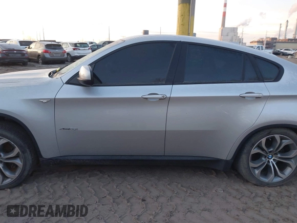 2012 BMW X6 50i z VIN 5UXFG8C58CL590171, wystawiony jako IAAI lot #41087730 z przebiegiem 83 143 mil mil oraz . Historia ofert i sprzedaży dostępna na DreamBid. Obrazek 14.
