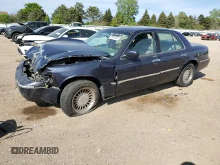 1999 Mercury Grand Marquis LS z VIN 2MEFM75W1XX635839, wystawiony jako Copart lot #55860735 z przebiegiem 114 963 mil mil oraz Szkody całkowita. Historia ofert i sprzedaży dostępna na DreamBid. Obrazek 1.