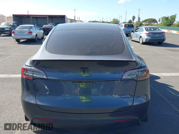 2023 Tesla Model Y Long Range z VIN 7SAYGAEE4PF945847, wystawiony jako IAAI lot #41071924 z przebiegiem 33 454 mil mil oraz . Historia ofert i sprzedaży dostępna na DreamBid. Obrazek 17.