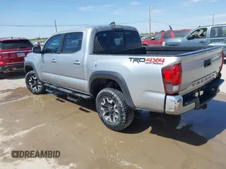 2018 Toyota Tacoma SR with VIN 3TMCZ5AN3JM170037, listed as a IAAI auction lot 42565385 with 157,450 mi miles and . Bid and sale history available at DreamBid. Image 3.
