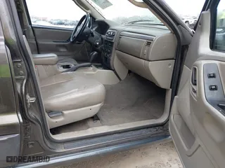 2004 Jeep Grand Cherokee Laredo with VIN 1J4GX48N74C412982, listed as a IAAI auction lot 41496258 with 195,671 mi miles. Bid and sale history available at carsss.com. Image 5.