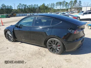 2023 Tesla Model Y Performance with VIN 7SAYGDEF2PF828973, listed as a Copart auction lot 45276585 with 15,750 mi miles and Salvage Title. Bid and sale history available at DreamBid. Image 2.