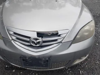 2006 Mazda 3 S Grand Touring z VIN JM1BK344561456189, wystawiony jako IAAI lot #42459158 z przebiegiem 167 794 mil mil oraz . Historia ofert i sprzedaży dostępna na DreamBid. Obrazek 6.