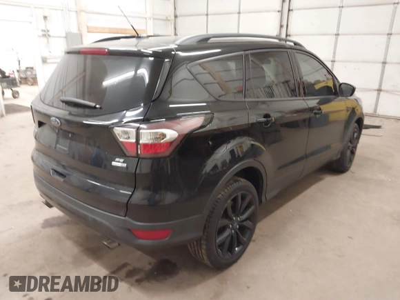 2017 Ford Escape SE with VIN 1FMCU9G98HUE31244, listed as a IAAI auction lot 40985971 with 88,067 mi miles. Bid and sale history available at carsss.com. Image 4.
