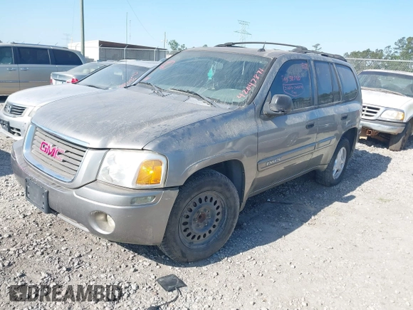 2005 GMC Envoy SLT with VIN 1GKDS13SX52175970, listed as a IAAI auction lot 42047871 with 205,432 mi miles. Bid and sale history available at carsss.com. Image 2.