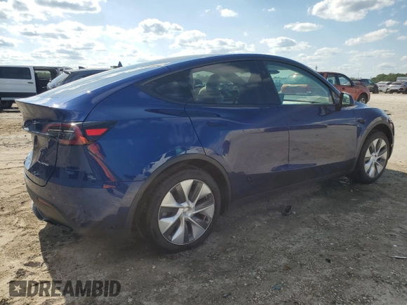 2023 Tesla Model Y Long Range z VIN 7SAYGDEE3PA178832, wystawiony jako Copart lot #57156005 z przebiegiem 12 920 mil mil oraz Szkoda całkowita • Salvage title. Historia ofert i sprzedaży dostępna na DreamBid. Obrazek 3.