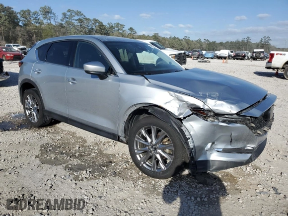 2021 Mazda CX-5 Grand Touring with VIN JM3KFADM8M1339008, listed as a Copart auction lot 49150115 with 144,851 mi miles and Salvage Title. Bid and sale history available at carsss.com. Image 4.