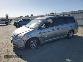 2007 Honda Odyssey EX with VIN 5FNRL38447B091261, listed as a Copart auction lot 60654125 with 175,127 mi miles and Salvage title. Bid and sale history available at DreamBid. Image 1.