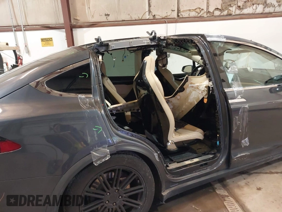 2016 Tesla Model X 70D with VIN 5YJXCBE2XGF025303, listed as a IAAI auction lot 41558869 with 77,793 mi miles and . Bid and sale history available at DreamBid. Image 6.