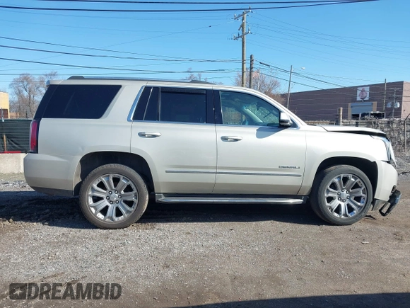 2016 GMC Yukon Denali with VIN 1GKS2CKJ5GR393269, listed as a IAAI auction lot 41963630 with 158,584 mi miles and . Bid and sale history available at DreamBid. Image 13.
