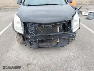 2015 Cadillac SRX Performance Collection with VIN 3GYFNFE35FS546905, listed as a IAAI auction lot 41588405 with 145,620 mi miles. Bid and sale history available at carsss.com. Image 6.