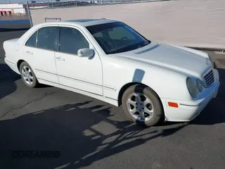 2002 Mercedes-Benz E-Class with VIN WDBJF65J22B455901, listed as a IAAI auction lot 41679008 with 153,854 mi miles. Bid and sale history available at carsss.com. Image 1.