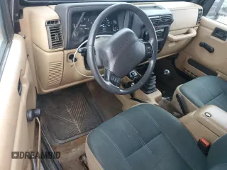 2000 Jeep Wrangler Sahara with VIN 1J4FA59S5YP761127, listed as a Copart auction lot 65247225 with 174,274 mi miles and Clean title. Bid and sale history available at DreamBid. Image 8.