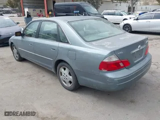 2003 Toyota Avalon XL with VIN 4T1BF28B83U318529, listed as a IAAI auction lot 42058121 with 171,889 mi miles. Bid and sale history available at carsss.com. Image 3.