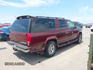 1999 Chevrolet Suburban with VIN 1GBFK16R5XJ335005, listed as a IAAI auction lot 42542755 with 200,599 mi miles and . Bid and sale history available at DreamBid. Image 4.