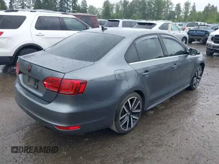 2014 Volkswagen Jetta GLI z VIN 3VW4T7AJ2EM208598, wystawiony jako IAAI lot #42381855 z przebiegiem 82 761 mil mil oraz . Historia ofert i sprzedaży dostępna na DreamBid. Obrazek 4.