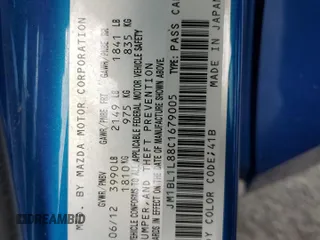 2012 Mazda 3 i Touring with VIN JM1BL1L88C1679005, listed as a Copart auction lot 64215215 with 133,091 mi miles and Salvage title. Bid and sale history available at DreamBid. Image 13.