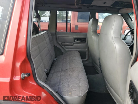 1996 Jeep Cherokee Sport with VIN 1J4FT68S8TL232241, listed as a Copart auction lot 82170904 with 287,125 mi miles and Salvage Title. Bid and sale history available at carsss.com. Image 10.