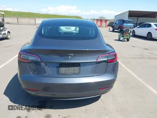 2022 Tesla Model 3 with VIN 5YJ3E1EA6NF144098, listed as a IAAI auction lot 41965360 with 75,597 mi miles. Bid and sale history available at carsss.com. Image 16.