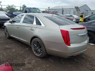2014 Cadillac XTS Platinum z VIN 2G61T5S31E9209179, wystawiony jako IAAI lot #42241440 z przebiegiem 79 651 mil mil oraz . Historia ofert i sprzedaży dostępna na DreamBid. Obrazek 3.