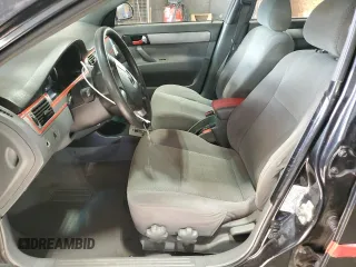 2008 Suzuki Forenza z VIN KL5JD56Z98K859749, wystawiony jako Copart lot #77630514 z przebiegiem 202 609 mil mil oraz Szkody całkowita. Historia ofert i sprzedaży dostępna na DreamBid. Obrazek 7.