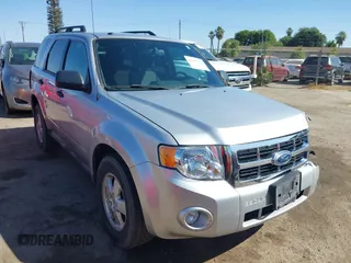 2012 Ford Escape XLT z VIN 1FMCU9DGXCKB55950, wystawiony jako IAAI lot #42490173 z przebiegiem 221 795 mil mil oraz . Historia ofert i sprzedaży dostępna na DreamBid. Obrazek 1.
