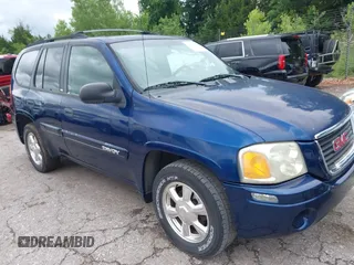 2003 GMC Envoy SLE z VIN 1GKDS13S432414698, wystawiony jako IAAI lot #42338640 z przebiegiem 210 988 mil mil oraz . Historia ofert i sprzedaży dostępna na DreamBid. Obrazek 1.